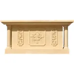 A beige marble altar featuring intricate carvings of a cross, floral patterns, and a central design element, supported by two columns.