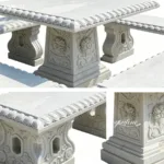 Detailed marble table featuring intricate rose carvings with textured edges and supporting marble legs, suitable for luxury settings.