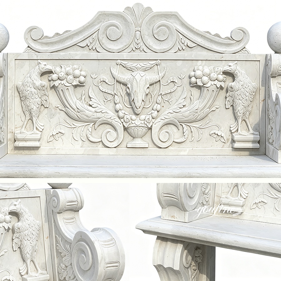 A detailed marble bench featuring carved motifs including birds, a ram's skull, foliage, and ornate patterns, showcasing skilled artistry.