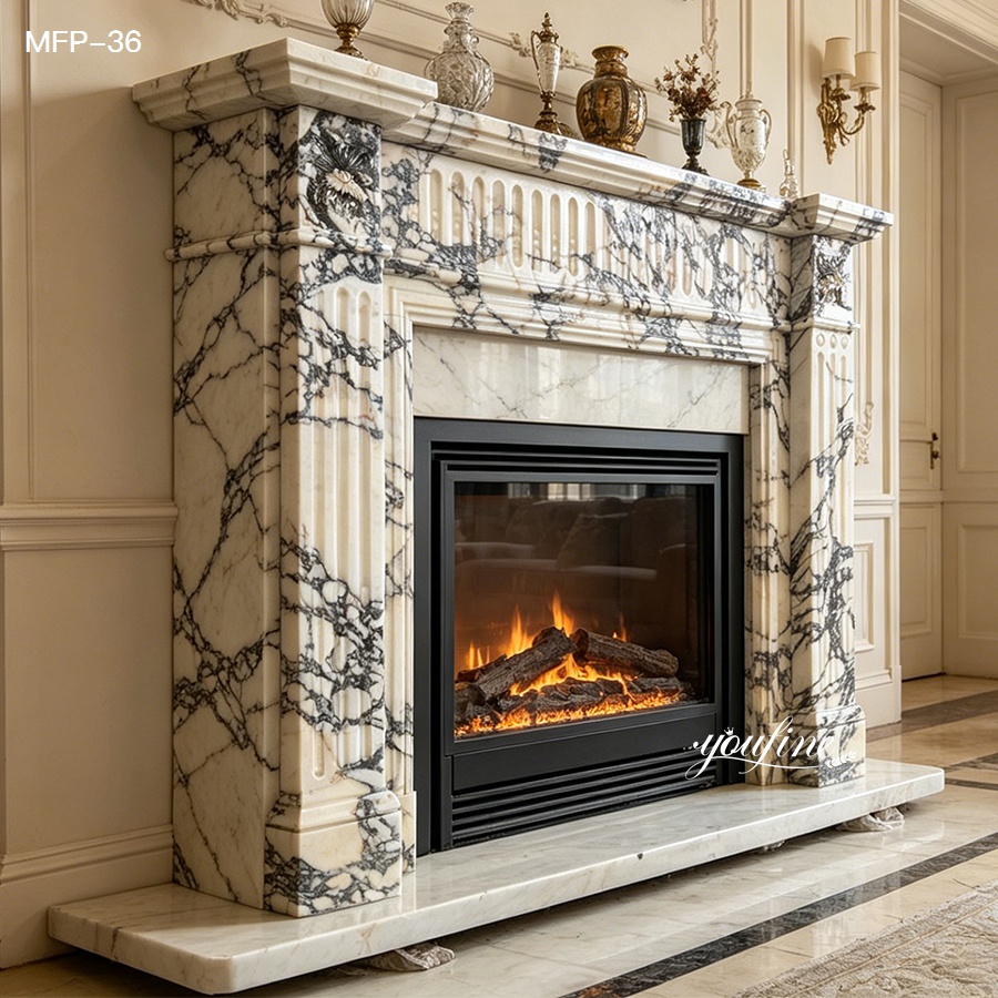 Elegant marble fireplace featuring intricate carvings, black veining, and a cozy fire, set in a sophisticated interior.