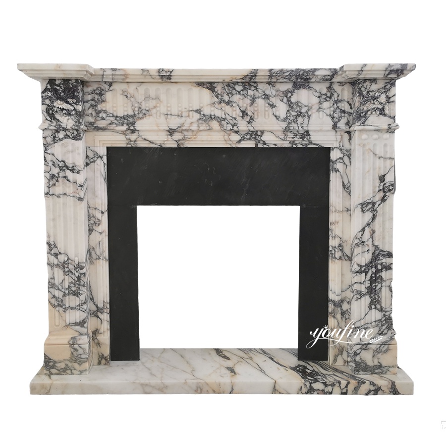 Elegant fireplace surround crafted from luxury black and white veined marble with intricate column designs and a sleek rectangular opening.