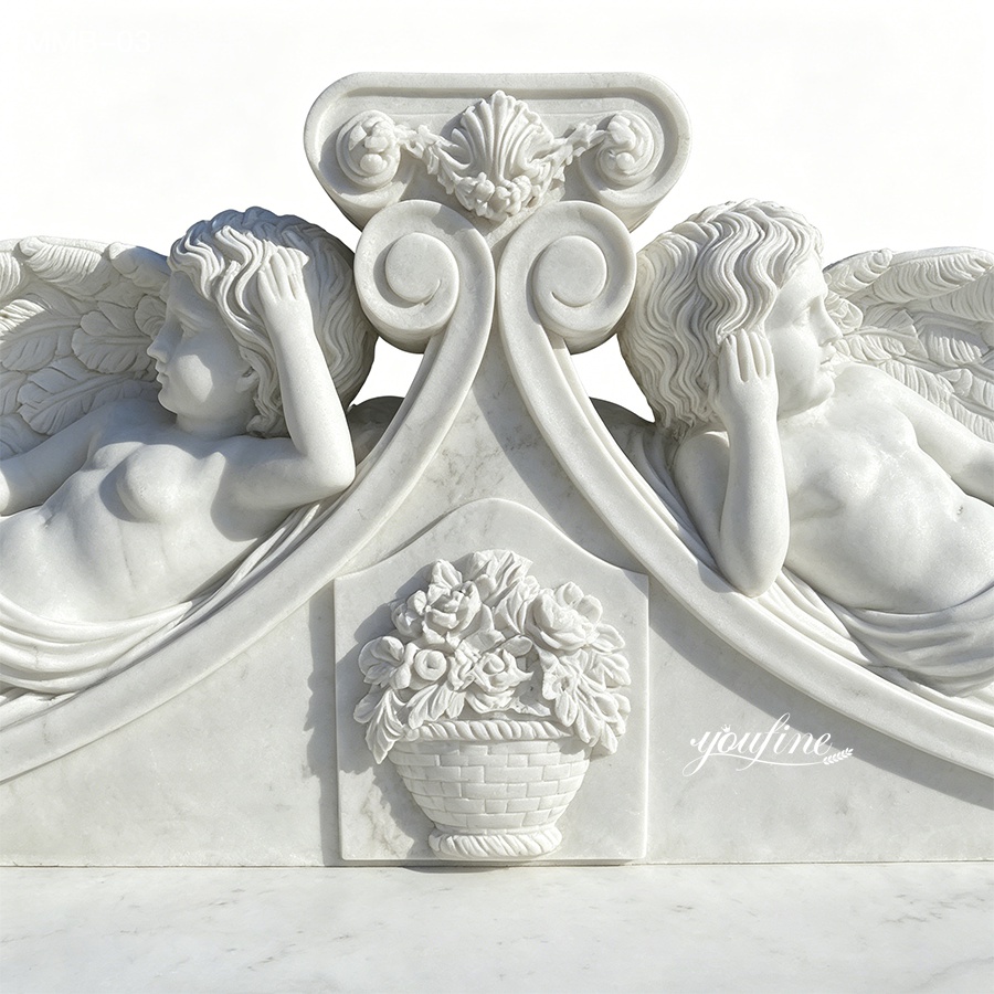 A finely carved marble sculpture featuring two reclining angels with detailed wings and floral basket relief accents.