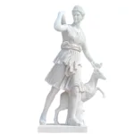 A finely detailed white marble statue of Artemis, the Greek goddess, holding a deer in a graceful pose, showcasing intricate carving.