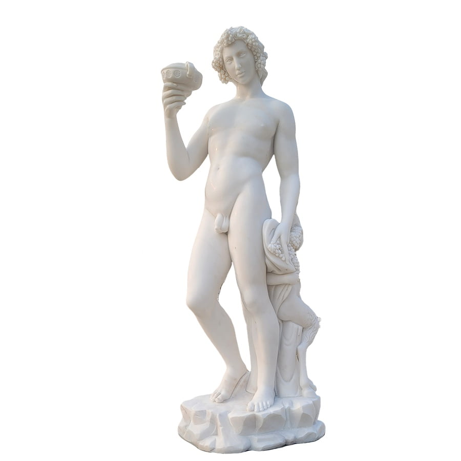 White marble sculpture of a nude male figure holding a cup in one hand and a bundle of grapes in the other on a textured base.