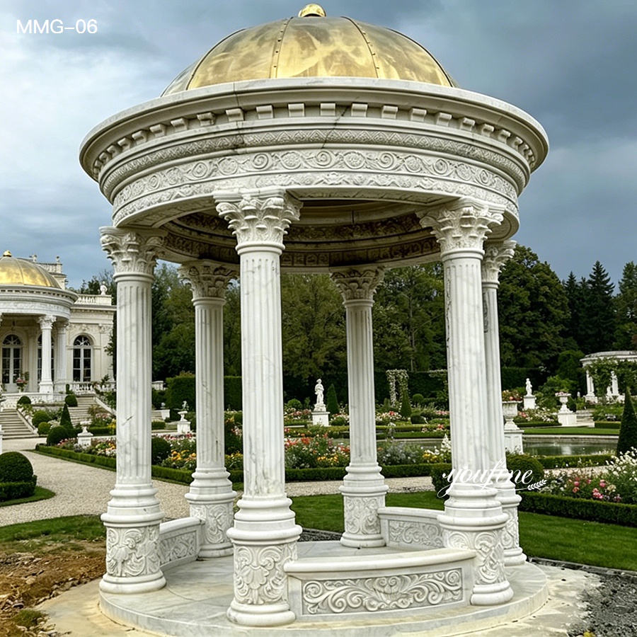Ornate marble gazebo with a golden dome and Corinthian columns, set in a lush formal garden with pathways and decorative landscaping.