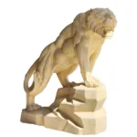 A detailed marble sculpture of a roaring lion standing on a rock base, showcasing expert craftsmanship in marble carving.