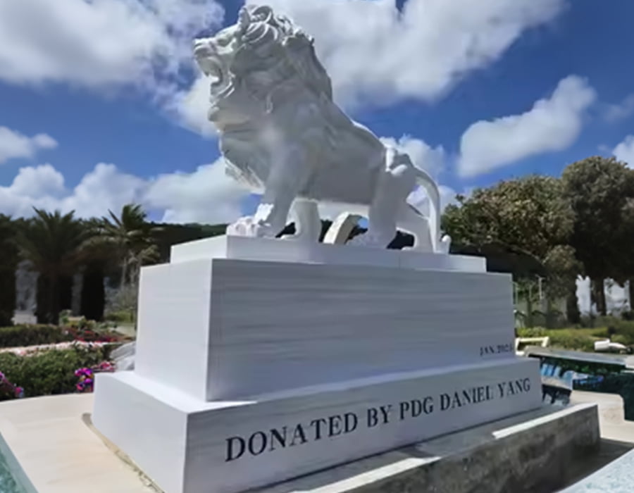 Majestic marble lion statue on engraved base