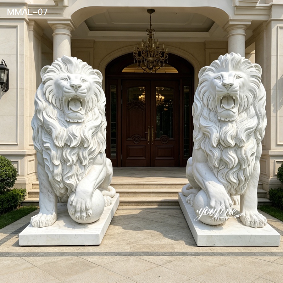 Two intricately carved marble lion statues guarding a luxurious building entrance with a wooden double door and chandelier.
