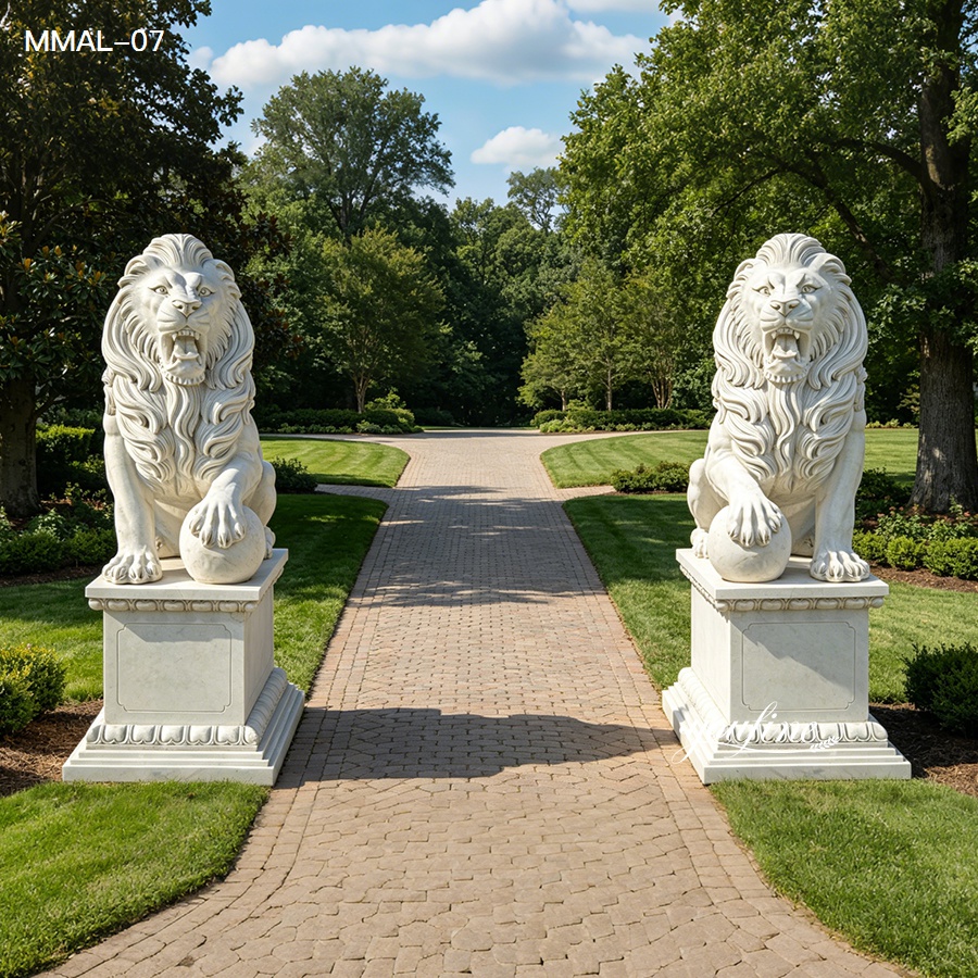 Two intricately carved marble lion statues on pedestals marking the entrance to a brick garden pathway surrounded by greenery.