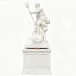 A finely crafted white marble sculpture of Poseidon holding a trident, standing on a detailed pedestal, showcasing classical artistry.