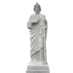 A finely crafted white marble statue of a religious figure holding a staff and medallion, featuring detailed drapery and standing on a pedestal.