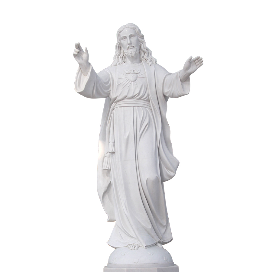 White marble statue of the Sacred Heart with flowing robes and open arms, showcasing detailed carving and religious symbolism.