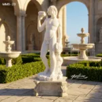 Classical white marble statue of a young figure holding a goblet, set in a lavish courtyard with fountains and trimmed hedges.