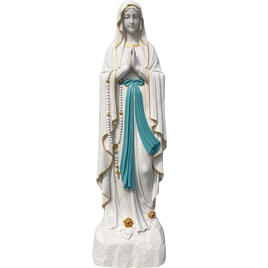 A hand-carved marble statue of the Virgin Mary featuring detailed robes, a rosary, and golden accents, standing on a stone base.