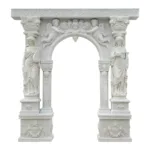 An intricately carved white marble arch featuring ornate details, two female figure sculptures on either side, and cherubic carvings above.