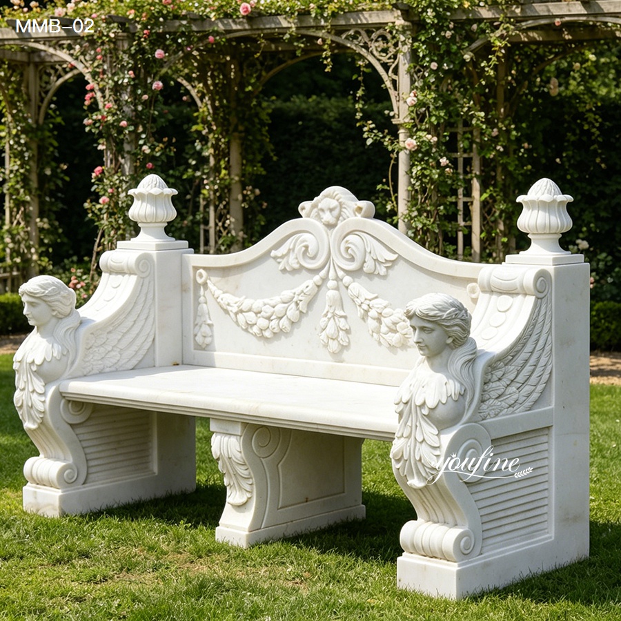 Elegant white marble bench with intricate carvings, including cherubs and floral designs, placed in a lush garden with arched trellises.