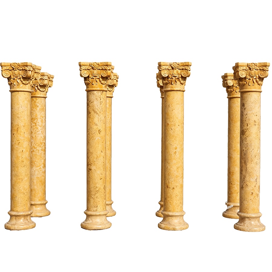 Six detailed yellow marble columns with intricate floral capitals, showcasing craftsmanship and elegance for architectural design.