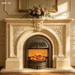 Elegant marble fireplace surround with intricate carved details and floral motifs, showcased with a cozy glowing fire and a delicate flower arrangement on top.