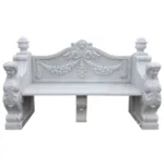 Elegant white marble bench featuring intricate floral and scrollwork carvings on the backrest, armrests, and legs.