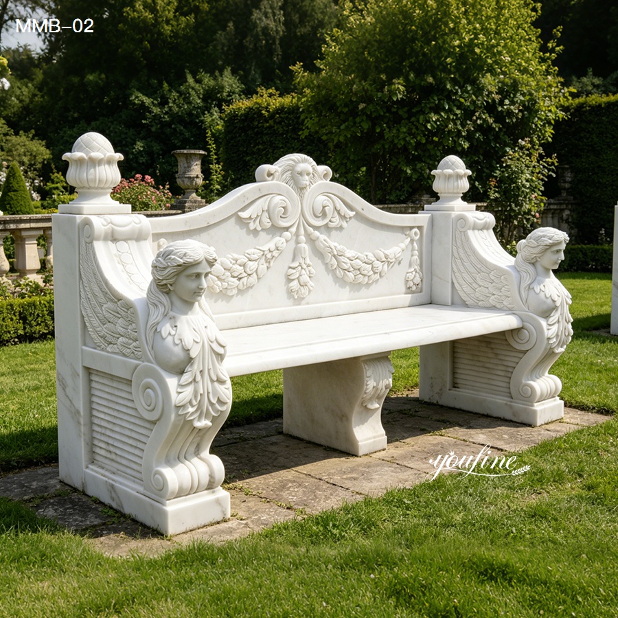 Exquisitely detailed white marble bench featuring intricate carvings of floral patterns and sculpted female busts on the armrests, placed in a lush garden setting.