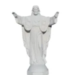 A Sacred Heart marble statue depicting a figure with open arms, detailed robe carvings, and heart emblem on the chest.