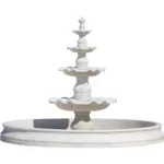 A four-tiered white marble fountain with ornamental carvings and a circular basin, showcasing a luxurious design ideal for outdoor spaces.