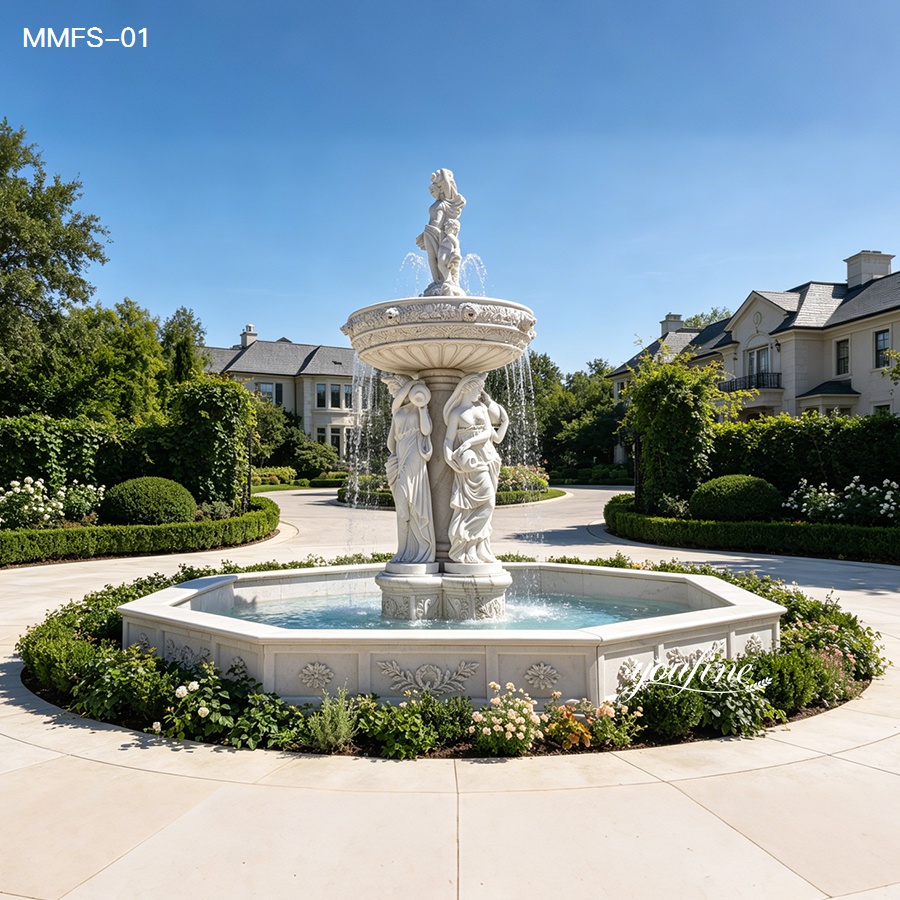 Elegant white marble fountain featuring detailed sculptures of female figures, set in a landscaped garden with a luxurious mansion in the background.