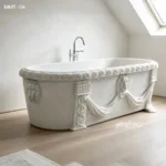 White marble bathtub with intricate lion head ornaments and classical draped detailing, placed in a bright modern bathroom.