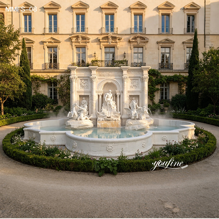 Ornate marble fountain featuring detailed sculptures in a serene courtyard surrounded by greenery and a classic facade.