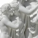 Exquisite close-up of a white marble sculpture depicting an embracing couple with intricate detailing of their hair and features.