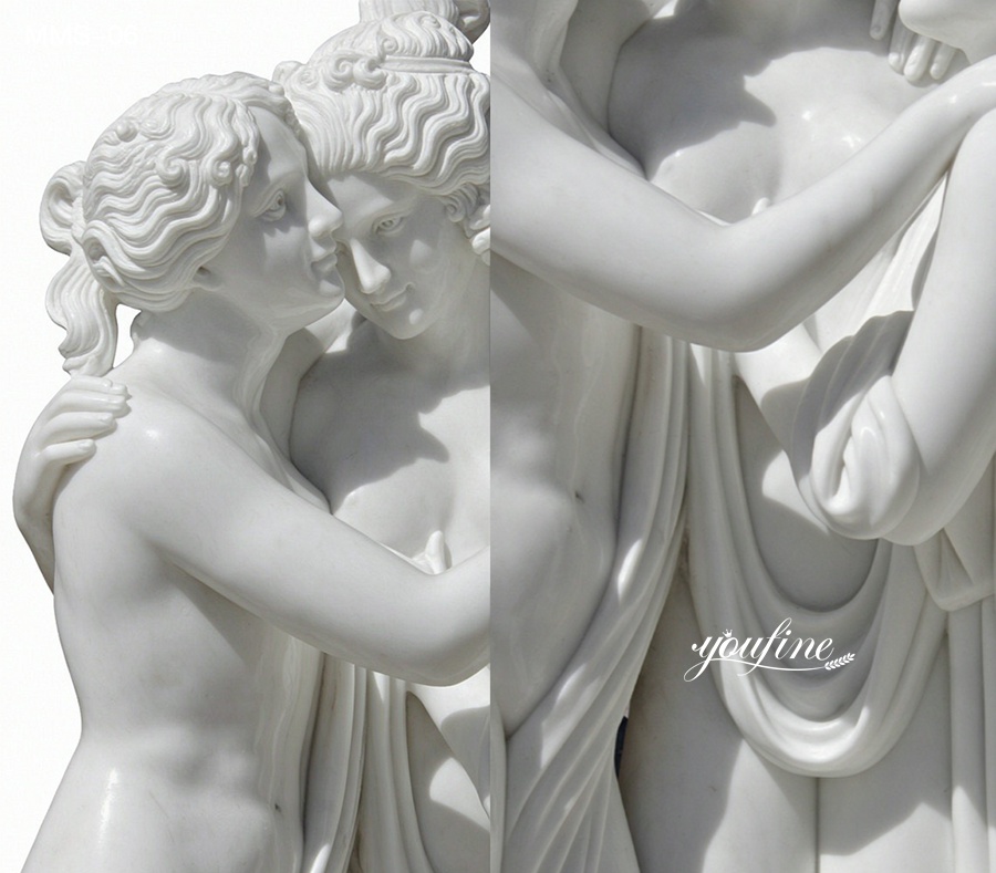 Exquisite close-up of a white marble sculpture depicting an embracing couple with intricate detailing of their hair and features.