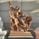 A life-sized marble sculpture of Laocoön and His Sons, depicting dramatic expressions and intricate detail against a neutral wall.