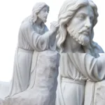 White marble sculpture of Jesus in prayer, with intricate details on the face, beard, and hands, showcasing superior craftsmanship.