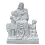 White marble sculpture depicting Jesus seated with three children surrounding him, showcasing detailed carving and serene expressions.