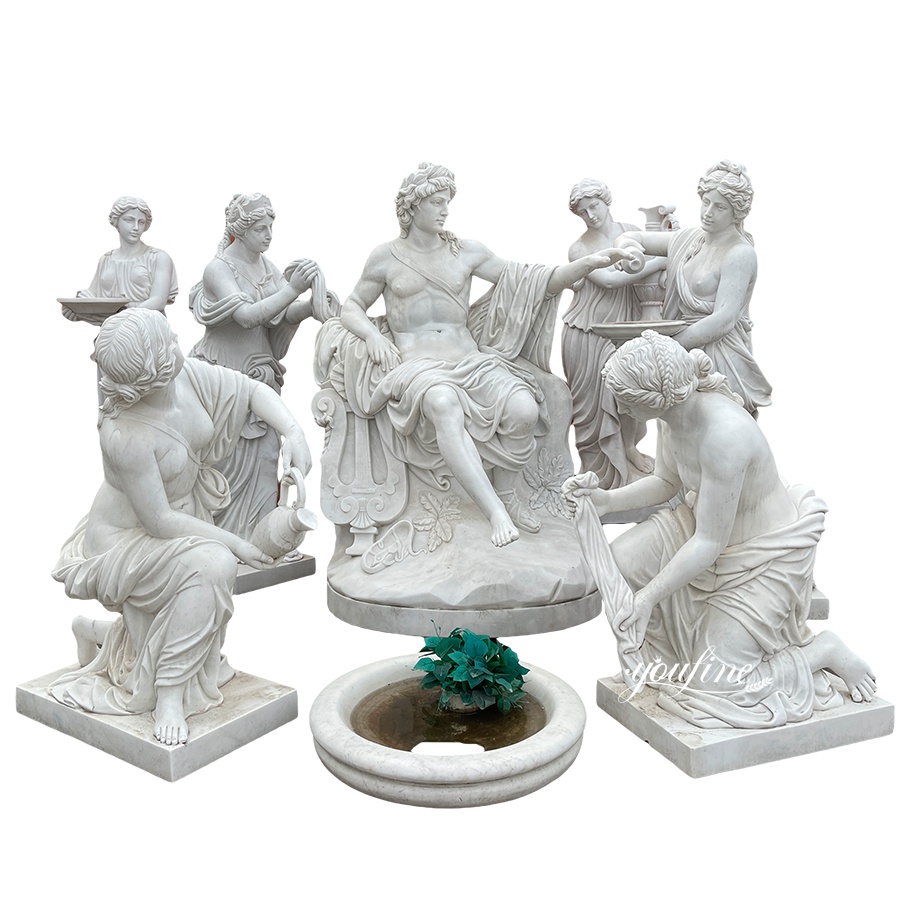 Set of intricately carved marble sculptures of Roman figures, including a central seated figure surrounded by attendants, with a small fountain in front.