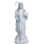 White marble sculpture of Jesus depicted as the Good Shepherd holding a lamb and a shepherd’s staff, symbolizing care and guidance.
