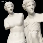 Close-up of a finely carved marble Venus de Milo sculpture with intricate details and a polished finish, showcasing classic Greek artistry.