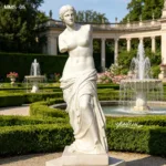 Outdoor marble Venus sculpture on a pedestal, surrounded by a formal garden with fountains and classical architecture.