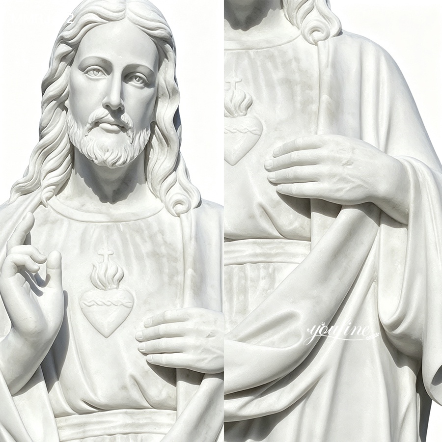 Close-up view of a white marble statue of the Sacred Heart of Jesus, showcasing intricate details on the facial features, hands, and clothing.