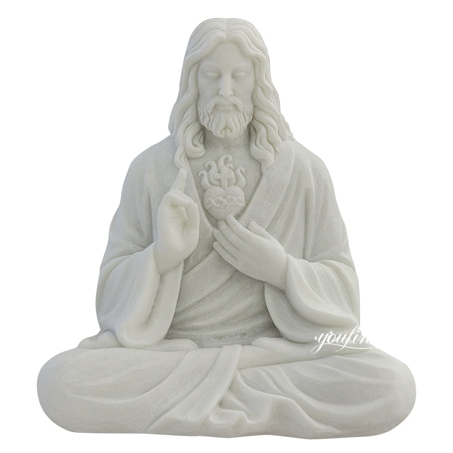 Intricately carved marble statue of the Sacred Heart seated with hand gestures conveying blessing and serenity.