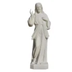 A finely crafted white marble statue of Jesus Christ with intricate drapery, a serene expression, and a blessing hand gesture.